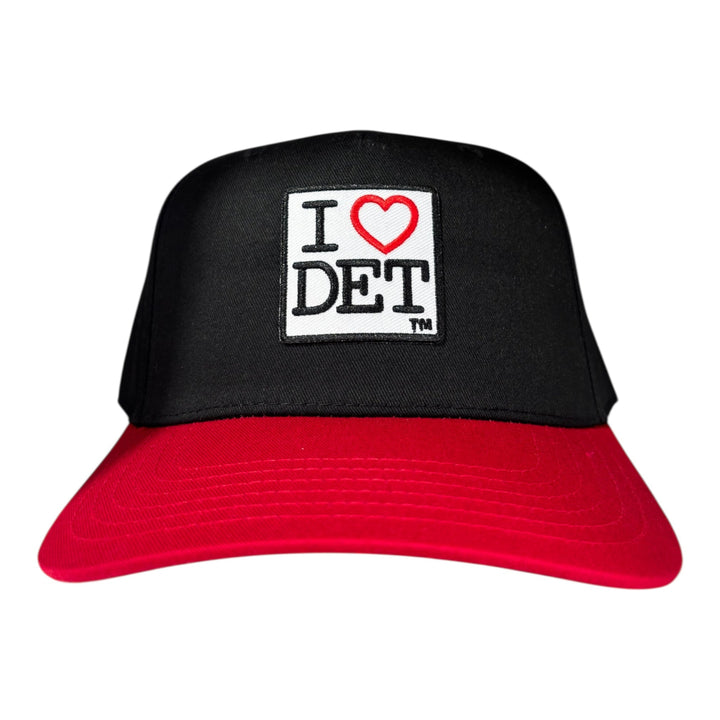 Black and red cap with 'I ❤️ DET' patch on a white background