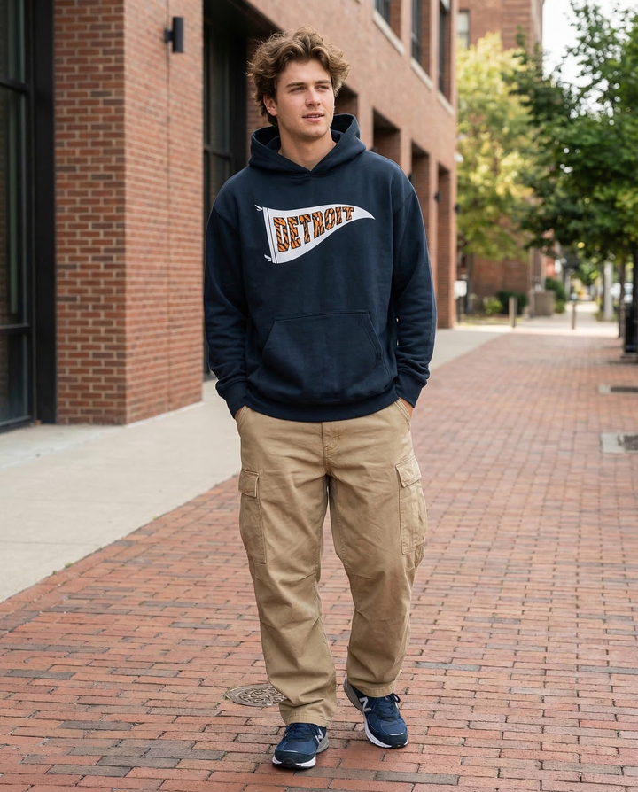 Male model walking wearing a Ink Detroit Tiger striped pennant hoodie