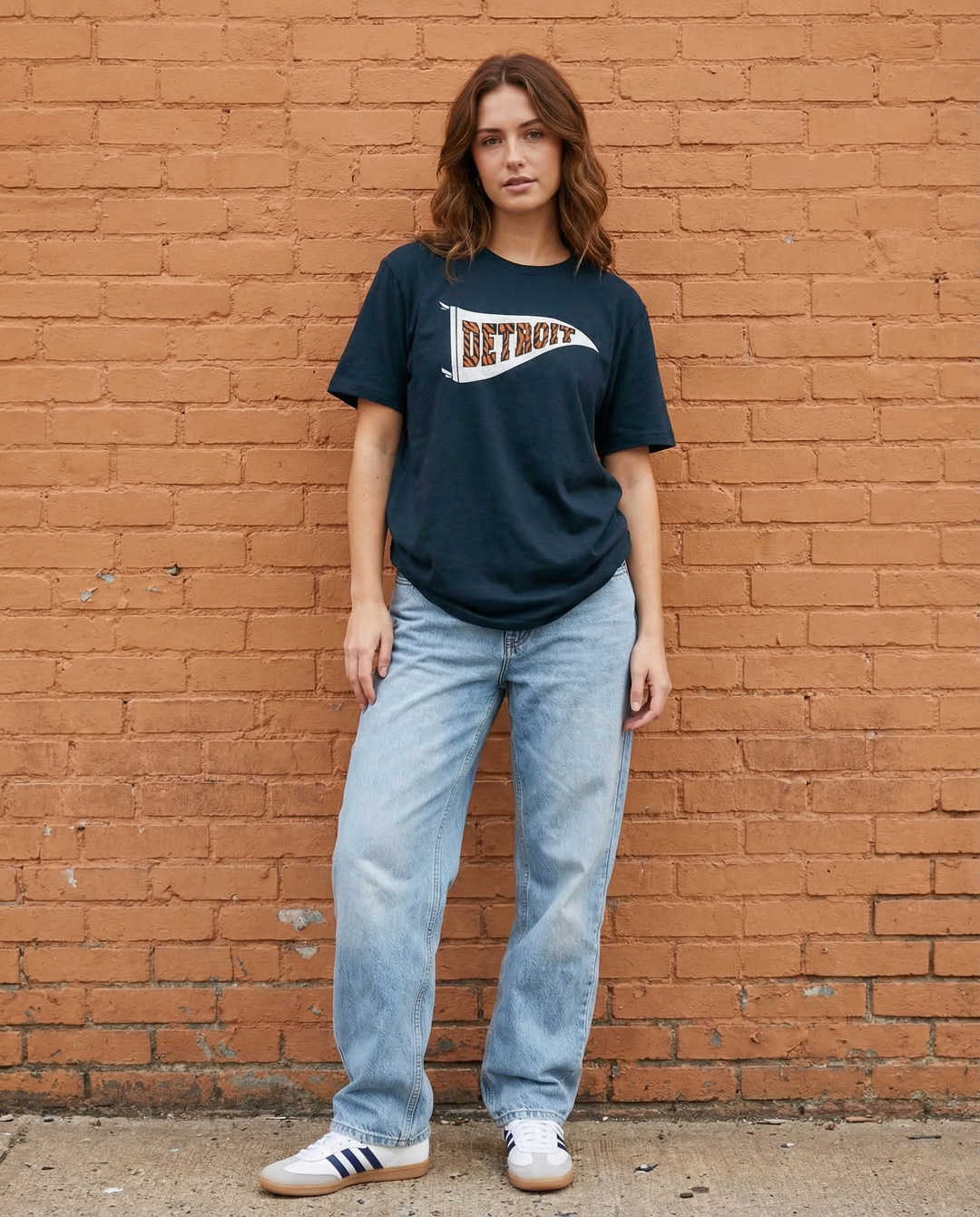 Female model wearing Ink Detroit Tiger striped pennant tee